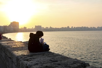 Alexandria, Egypt. December 1st 2022 A Muslim Egyptian female student studying on the corniche