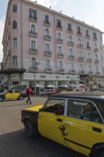 Alexandria, Egypt. December 4th 2022 A black and yellow Alexandria taxi in the street outside the