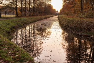On the canal, visual axis to the pheasant castle in morning light, Moritzburg Castle Park, Saxony,