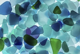 Mainly blue broken glass from the sea, sea glass, sea glass, beach glass from the North Sea