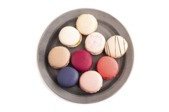Macarons colourful cookies dessert isolated on white background, close up, top view, flat lay