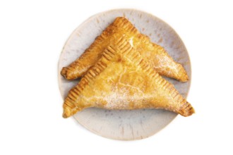 Triangles Pie, Puff Pastry, Samsa with cherry jam isolated on white background, top view, flat lay,