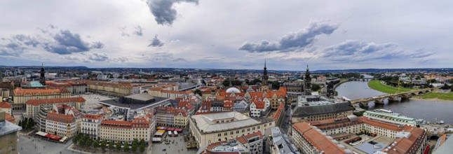 Bird's eye view of Dresden with red roofs and Elbe, under a cloudy sky, Dresden