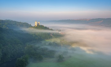 View of the Saaleck castle ruins in morning fog in the Saale Valley, Bad Kösen, Burgenlandkreis,