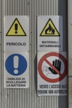 Warning signs on a factory gate, Veneto, Italy