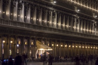 Authorized parties in a nocturnal atmosphere with music band on St. Mark's Square, Venice, Veneto,