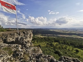 Franconian flag flies on Staffel Mountain, with a wide view over the lowlands and sky, Frankenwald