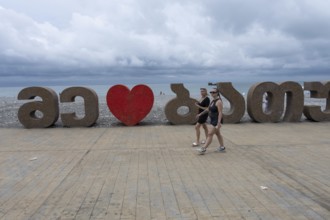 Batumi, Georgia. July 21st 2025. Tourists walking along the seaside esplanade near Batumi Port on