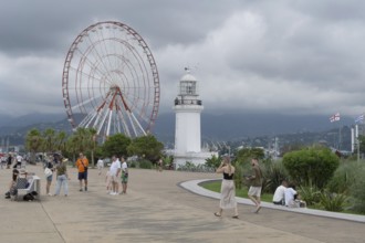 Batumi, Georgia. July 21st 2025. A light house and Ferris wheel near Batumi Port, a popular
