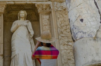 Ephesus, Turkey. July 2nd 2015 A foreign tourist takes a photogaph of a Greek statue at Ephesus,