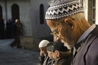 Antakya, Turkey. December 21st 2013 Old Turkish men in the courtyard of a mosque in Antakya, Turkey