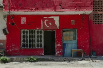 Adana, Turkey. 8th June 2014 Red painted workshop building in the Anatolian city of Adana, Turkey