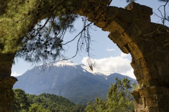 The Turkish Bey Mountains seen through the silhouette of the Phaselis Aqueduct, Kemer, Antalya,