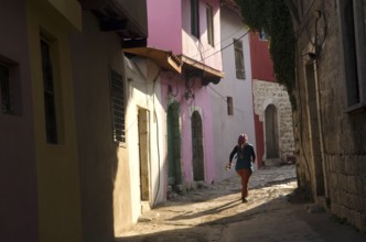 Antakya, Turkey. December 22rd 2013 Young local girl runs through the narrow alleyways of the old