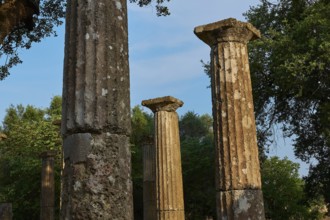Palestra, tall, ancient columns against a bright blue sky, Archaeological Site, Ancient Olympia,