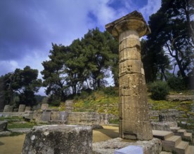 Hera Temple, Temple of Hera, Heraion, Single tall pillar in a natural setting under cloudy sky,