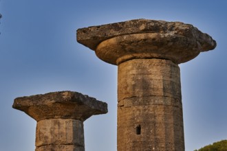 Temple of Hera, Temple of Hera, Heraion, Two ancient stone pillars against a clear blue sky,