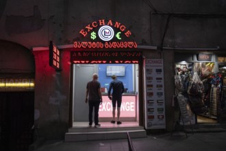 Tbilisi, Georgia. September 5th 2025. Foreign tourists changing money at a Georgian currency
