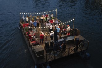 Tbilisi, Georgia. September 5th 2025. Tourists enjoy dancing and drinking on a floating raft type