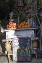 A local street stall selling fresh pomegranate and orange juice in the Old Town district of