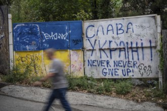 Tbilisi, Georgia. September 15th 2025. Graffiti saying Glory to Ukraine and the flag of Ukraine