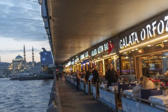 Istanbul, Turkey. January 3rd 2025 Fish restaurants at night on the the iconic Galata Bridge at the