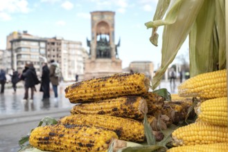Freshly grilled corn on the cob for sale on a typical Turkish street stall in Taksim Square on the