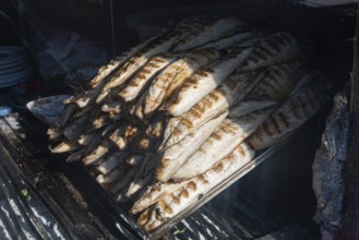 Delicious looking grilled mackerel an ready to prepare Balik Ekmek, a traditional Turkish street