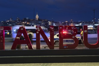 Istanbul, Turkey. January 3rd 2025. A busy road at night with a police traffic patrol in the