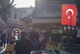 Istanbul, Turkey. January 3rd 2025. A man trying a pair sunglasses in a busy shopping bazaar in the