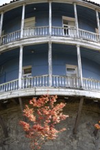 Tbilisi, Georgia. August 5th 2025. An old traditional blue painted Georgian building with a typical