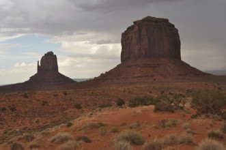 Large and small rock formations in the desert landscape of Monument Valley, Navajo Tribal Park,