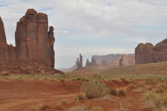 Wide, dry landscape with distinctive rocks and red sand, Monument Valley, Navajo Tribal Park,