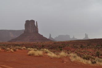 View of Monument Valley's distinctive rock formations after a heavy thunderstorm. Monument Valley,