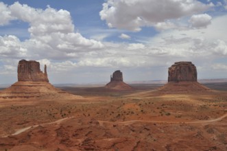Dramatic rock formations against a cloudy sky in Monument Valley, Navajo Tribal Park, Navajo Nation