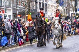 Rose Monday procession in Düsseldorf, group of horses at the street carnival, sometimes heavy rain,