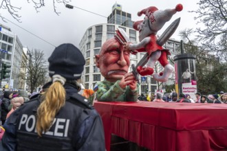 Rose Monday procession in Düsseldorf, theme car by wagon maker Jacques Tilly, Putin impales the
