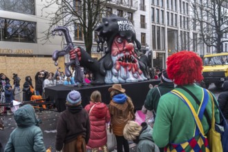 Rose Monday procession in Düsseldorf, theme car by wagon manufacturer Jacques Tilly, topic of mass
