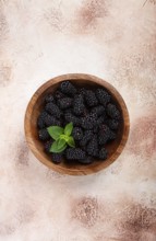 Blackberries, in a wooden bowl, top view, no people