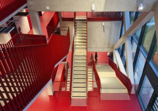 Staircase with signal red color scheme in seminar building H of Bochum University, Ruhr area, North