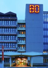 Main building of Bochum University with red BO logo in the evening, Central Campus, Bochum, Ruhr