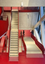 Staircase with signal red color scheme in seminar building H of Bochum University, Ruhr area, North