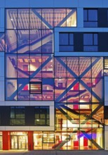 Bochum University seminar building in the evening with an eye-catching staircase with a signal red