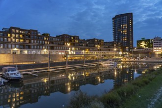 Maasboulevard and city harbor in Venlo at dusk, the Netherlands
