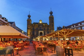 Restaurant and the historic town hall on the market in Venlo at dusk, the Netherlands