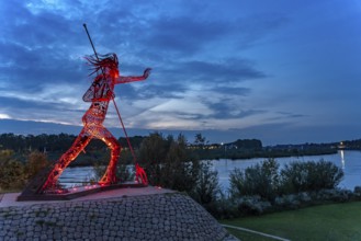 Peaceful Warrior Vreedzame Krijger sculpture on the Maas at dusk, Venlo, the Netherlands