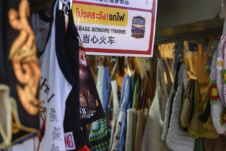 Mae Klong, Thailand. March 15th 2025. A sign warning tourists to beware of the train at the Mae