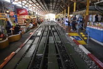 Mae Klong, Thailand. March 15th 2025. Rail lines at the Maeklong Railway station with cafes and