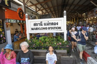 Mae Klong, Thailand. March 15th 2025. Tourists at the entrance to The Maeklong Railway station in