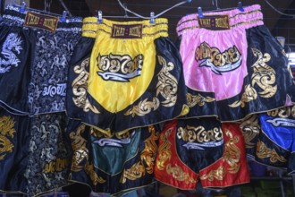 Mae Klong, Thailand. March 15th 2025. Muay Thai martial arts boxing shorts for sale as tourist